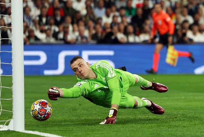 Real Madrid goalkeeper Andriy Lunin fails to keep out Bernardo Silva's free-kick for Man City's opening goal. Reuters