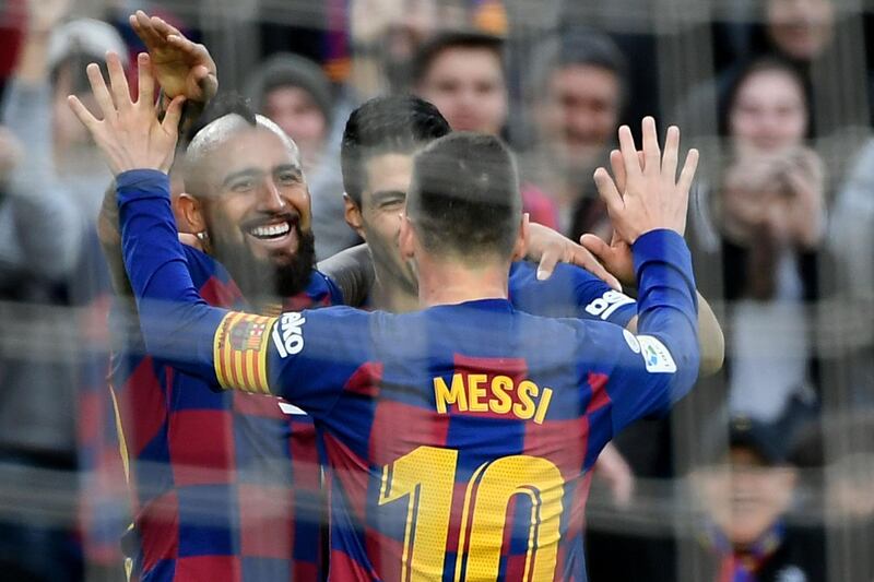 Arturo Vidal, Luis Suarez and  Lionel Messi celebrate. AFP