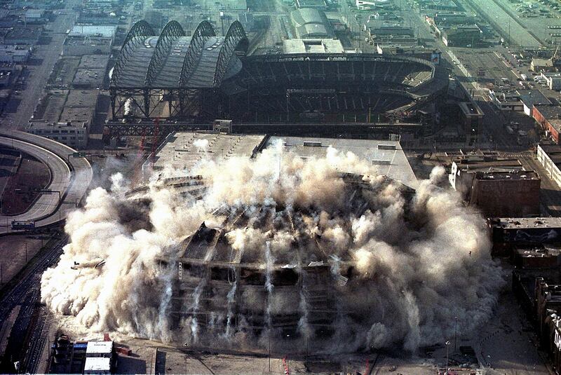 The Seattle Kingdome, home of the Seattle Seahawks American football team, implodes on March 26, 2000, in Seattle, Washington. AFP