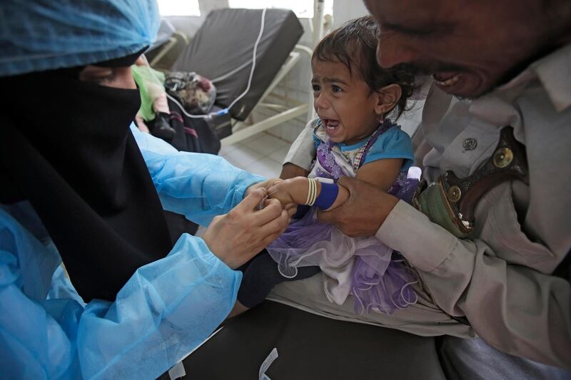 A girl is treated for a suspected cholera infection at a hospital in Sanaa, Yemen.  AP