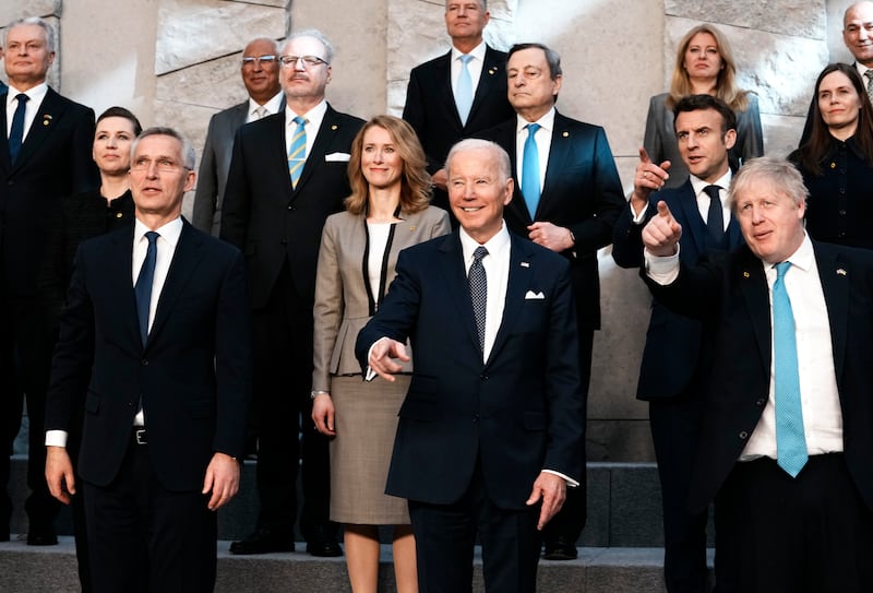 Nato Secretary General Jens Stoltenberg, front left, US President Joe Biden and British Prime Minister Boris Johnson pose for a photo during an extraordinary Nato summit in Brussels. AP Photo