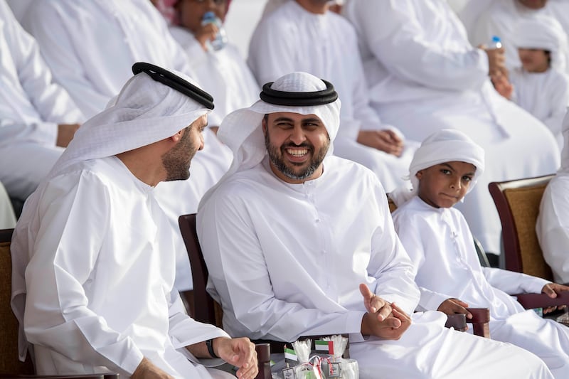 Sheikh Diab bin Zayed (C), speaks with Sheikh Mohammed bin Hamad (L), during the graduation ceremony for summer course volunteer cadets at Sieh Al Hama military camp. Rashed Al Mansoori / Crown Prince Court - Abu Dhabi