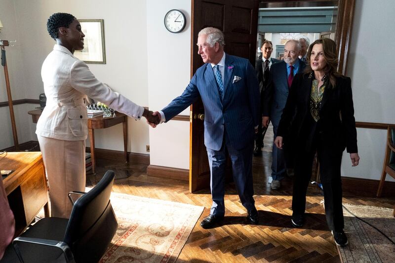 Britain's Prince Charles meets British actor Lashana Lynch as he tours the set of the 25th James Bond Film at Pinewood Studios. Lynch will play a character called Nomi in Bond 25. Reuters