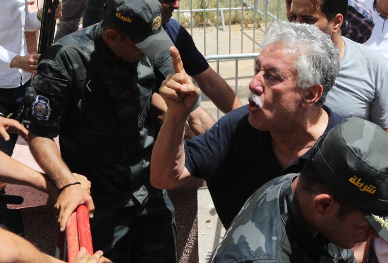 The leader of Tunisia's Popular Front party, Hamma Hammami, shouts slogans during a demonstration against President Kais Saied and a referendum on a new constitution to be held on  July 25. EPA