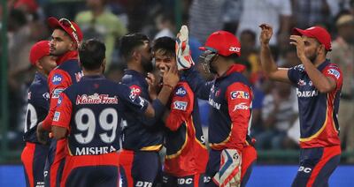 Delhi Daredevils Sandeep Lamichhane, center, celebrates the wicket of Mumbai Indians Evin Lewis during the VIVO IPL Twenty20 cricket match in New Delhi, India, Sunday, May 20, 2018. (AP Photo/Manish Swarup)