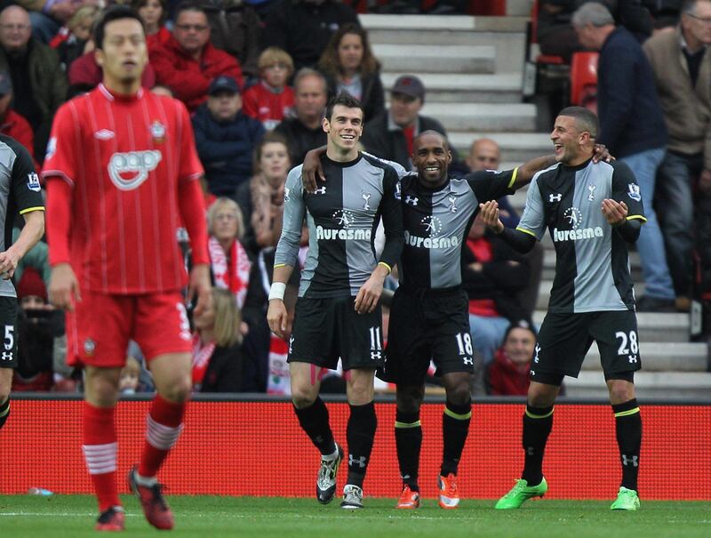 Tottenham Hotspur's Gareth Bale, second left, is congratulated on scoring the opening goal of the game by teammates Jermain  Defoe, second right, and Kyle Walker, right, during an English Premier League match at St Mary's Stadium, Southampton, England Sunday Oct. 28, 2012.   (AP Photo/PA Wire)  UNITED KINGDOM OUT NO SALES NO ARCHIVE  *** Local Caption ***  Britain Soccer Premier League.JPEG-0d50a.jpg