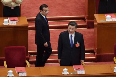 Chinese President Xi Jinping (R) and Premier Li Keqiang arrive for the the closing session of the National People's Congress at the Great Hall of the People in Beijing on May 28, 2020. China's rubber-stamp parliament has endorsed plans to impose a national security law on Hong Kong that critics say will destroy the city's autonomy. AFP