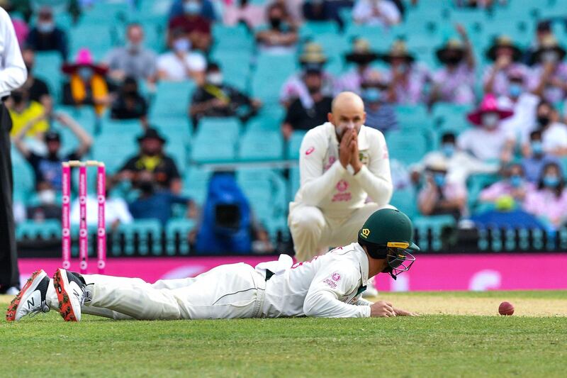 Australia bowler Nathan Lyon looks on after Matthew Wade's failed attempt to catch Ajinkya Rahane. AFP