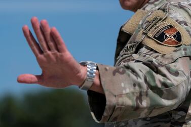 U. S.  Army General Austin Scott Miller, the former top U. S.  commander in Afghanistan, waves upon his return, at Andrews Air Force Base, U. S.  July 14, 2021.  Alex Brandon / Pool via REUTERS