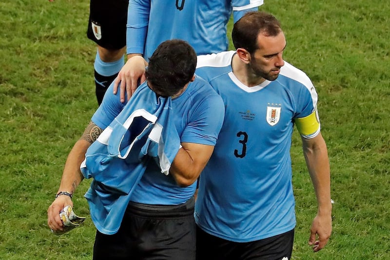 epa07683759 Uruguayan player Diego Godin (R) consoles teammate Luis Suarez (L) after he failed a goal during the penalty shoot-out after the Copa America 2019 quarter-finals soccer match between Uruguay and Peru, at Arena Fonte Nova Stadium in Salvador, Brazil, 29 June 2019.  EPA/Raul Spinasse