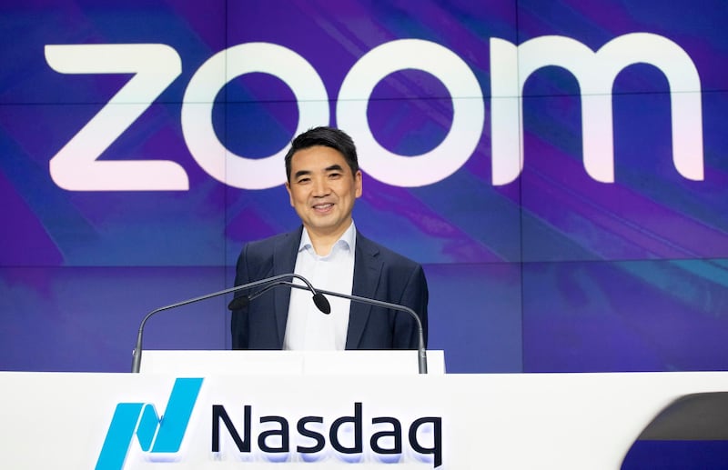 FILE - In this April 18, 2019 file photo, Zoom CEO Eric Yuan attends the opening bell at Nasdaq as his company holds its IPO in New York.  Millions of people are now working from home as part of the intensifying fight against the coronavirus outbreak. Beside relying on Zoom, the video conference service, more frequently as part of their jobs, more people are also tapping it to hold virtual happy hours with friends and family banned from gathering in public places.  (AP Photo/Mark Lennihan, File)