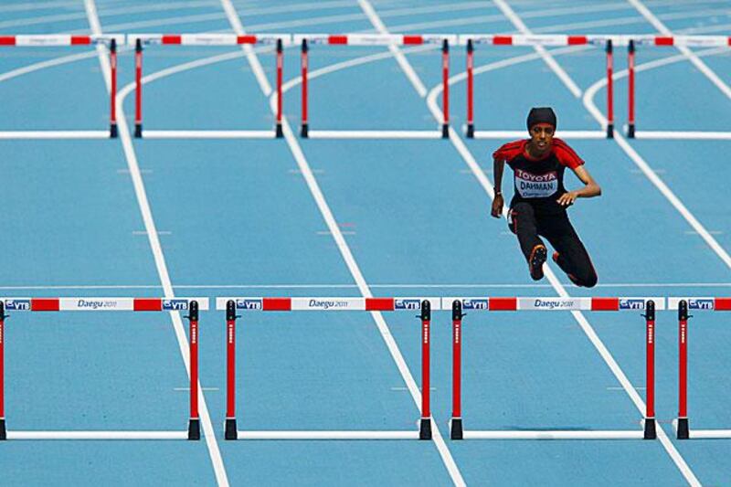Fatima Sulaiman Dahman of Yemen clears a hurdle during her heat in the womenâ€™s 400 metres hurdles.

David Gray / Reuters