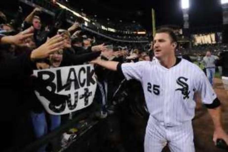 Chicago White Sox's Jim Thome celebrates with fans after the White Sox defeated the Minnesota Twins 1-0 in the American League Central tiebreaker baseball game Tuesday, Sept. 30, 2008, in Chicago. (AP Photo/Paul Beaty)  *** Local Caption ***  ILMG122_Twins_White_Sox_Baseball.jpg