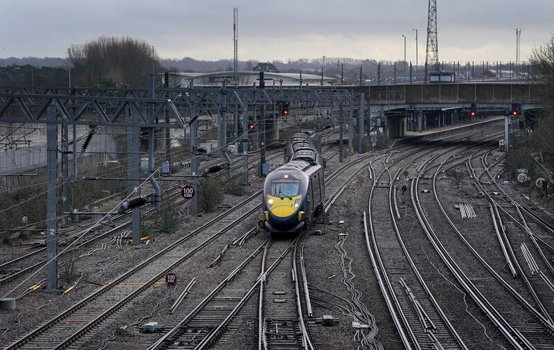 A lone train leaves Ashford station in Kent, where a reduced timetable is in operation. PA