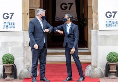 Britain's Chancellor of the Exchequer Rishi Sunak (R) welcomes Secretary-General of the Organisation for Economic Co-operation and Development (OECD) Matthias Corman to the G7 Finance Ministers Meeting at Lancaster House, central London on June 4, 2021.
 Group of Seven (G7) finance chiefs gather this week to hammer out an agreement on corporate tax harmonisation aimed at raising revenues as economies recover from the coronavirus pandemic. / AFP / POOL / Steve REIGATE
