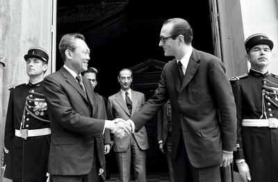 In a picture taken on July 2, 1974 Singapore Prime Minister  Lee Kuan Yew (L) shakes hands with French Prime Minister Jacques Chirac at Matignon in Paris. Lee served as prime minister from 1959, when Singapore gained self-rule from colonial ruler Britain, until he stepped down in 1990 in favour of his deputy Goh Chok Tong, who in turn handed power to Lee Hsien Loong in 2004. AFP PHOTO (Photo by STF / AFP)