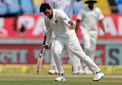 Indian cricketer Kuldeep Yadav celebrates after the dismissal of West Indies' Sunil Ambris during the third day of the first cricket test match between India and West Indies in Rajkot, India, Saturday, Oct. 6, 2018. (AP Photo/Rajanish Kakade)