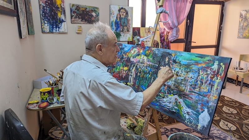 Iraqi artist Khaled Ridha, 70, paints in his studio in Kirkuk in the heart of disputed territory. Photo: Khazan Jangiz
