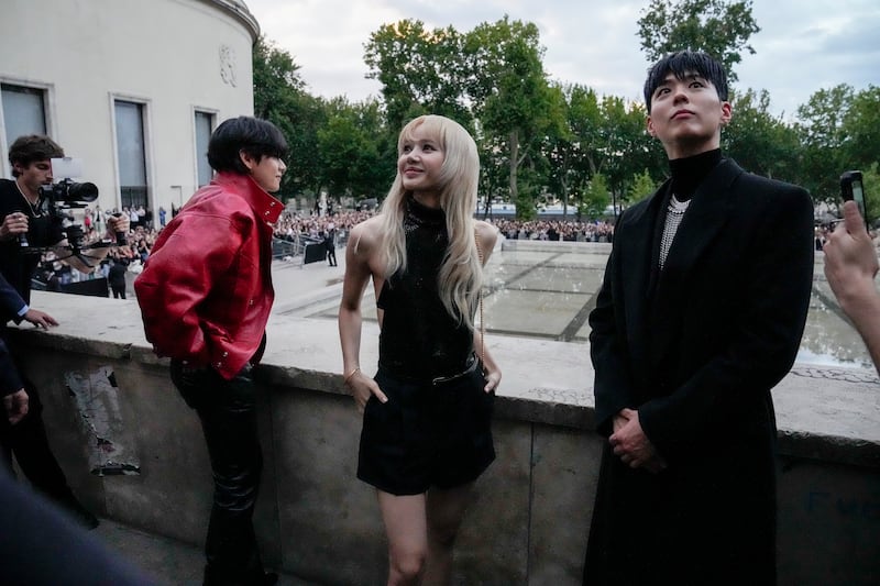 The K-pop stars caused quite a commotion upon their arrival at the Celine show. AP