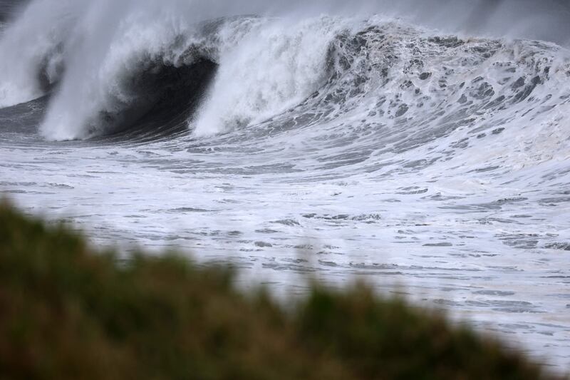 Waves crash along the shore as Cyclone Freddy nears Sainte-Anne. AFP