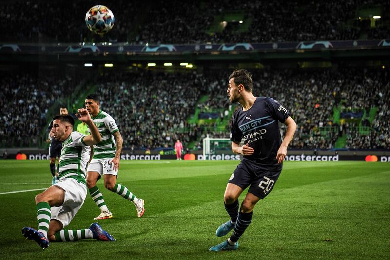 Manchester City's Bernardo Silva is blocked by Sporting Lisbon's Goncalo Inacio. AFP