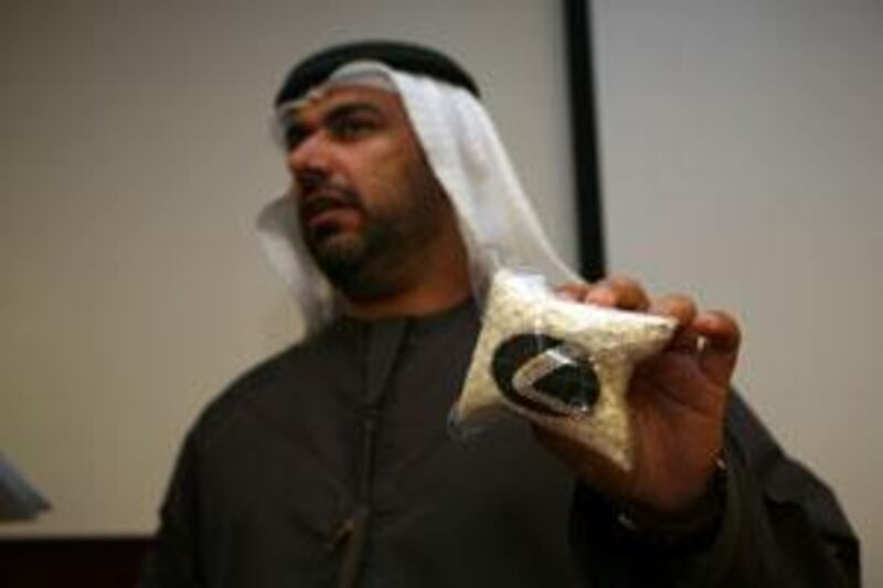 Yousef al Adiadi, the director of administration affairs, holds a bag of Captagon pills during a press conference in Dubai last year. The UAE's zero-tolerance policy has seen a decline in the Captagon abuse.