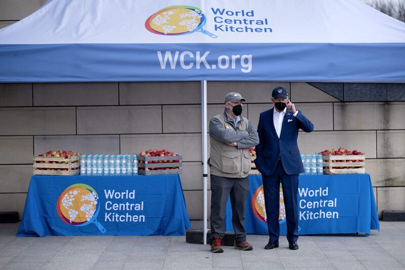 US President Joe Biden, right, stands with Spanish chef Jose Andres, founder of nonprofit organisation World Food Kitchen (WCK), after meeting refugees of Russia's war with Ukraine at PGE Narodowy Stadium in Warsaw, Poland on March 26, 2022. AFP