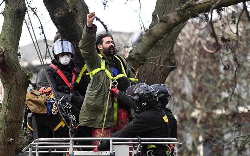 Police arrest a HS2 Rebellion protester from the camp at Euston Square. EPA