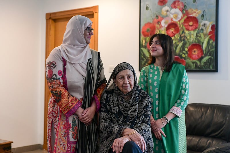 Three generations of Pasha women: Dr Rafeeya Sultan Pasha, centre, with her daughter Dua Sultan Pasha, left, and granddaughter Aisha Shahzad Ahmed, at their Abu Dhabi home. Khushnum Bhandari / The National