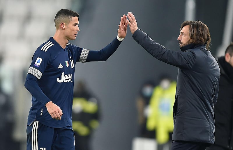 Cristiano Ronaldo celebrates with coach Andrea Pirlo after scoring his team's third goal during the Serie A match against Sassuolo. EPA
