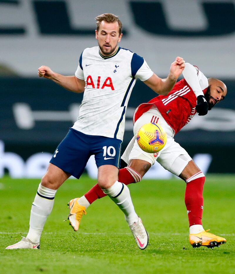 Tottenham Hotspur's Harry Kane battles with Arsenal's Alexandre Lacazette. AFP