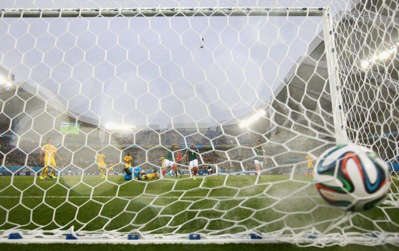 The ball is shown entering the net as Oribe Peralta scores the eventual winner in Mexico's 1-0 victory over Cameroon at World Cup 2014 on Friday in Natal, Brazil. Julian Finney / Getty Images