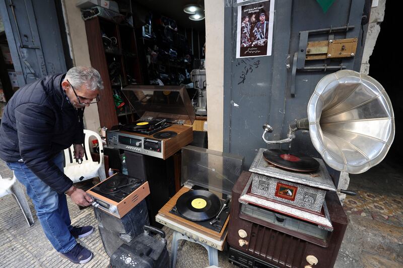 Strewn throughout his workshop, in various stages of repair, are record players from the 1960s and 1970s. There are even several gramophones from the 1940s 