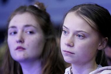Swedish climate change activist Greta Thunberg and Swiss activist Loukina Tille attend a session at the 50th World Economic Forum (WEF) annual meeting in Davos, Switzerland, January 21, 2020. Reuters
