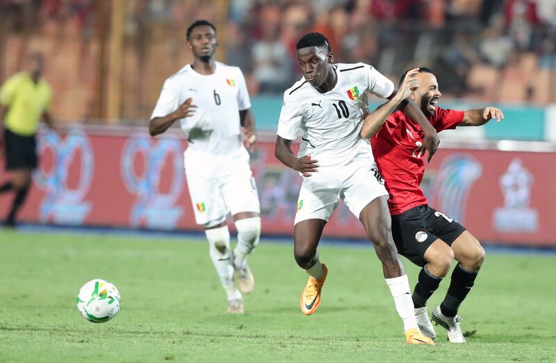 Egyptian player Mohamed Magdi Afsha (R) in action against Guinea player Ilaix Moriba (L) during the Africa Cup of Nations (AFCON) qualification soccer match between between Egypt and Guinea in Cairo, Egypt. EPA