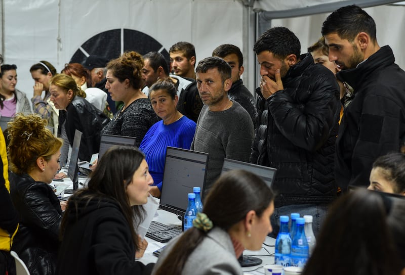 Ethnic Armenians at the registration centre. EPA