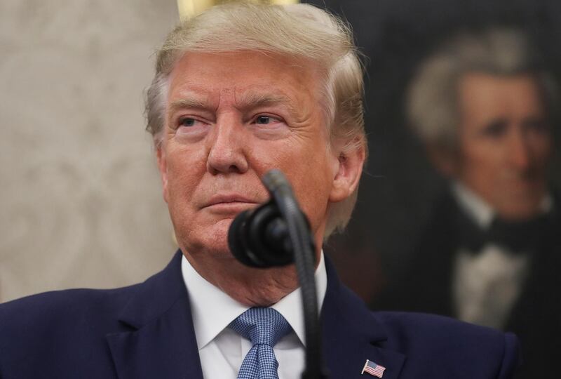 With a portrait of former U.S. President Andrew Jackson hanging in the background, U.S. President Donald Trump speaks as he awards the Presidential Medal of Freedom to former Attorney General Edwin Meese in the Oval Office of the White House in Washington, October 8, 2019.  REUTERS/Leah Millis