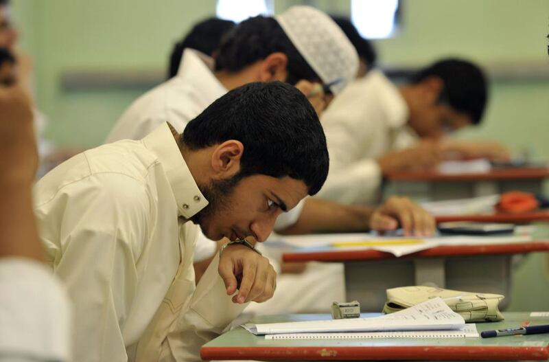 Saudi students sit for their final high school exams in the Red Sea port city of Jeddah on June 19, 2010 at the end of 2009/10 school year.  AFP PHOTO/AMER HILABI