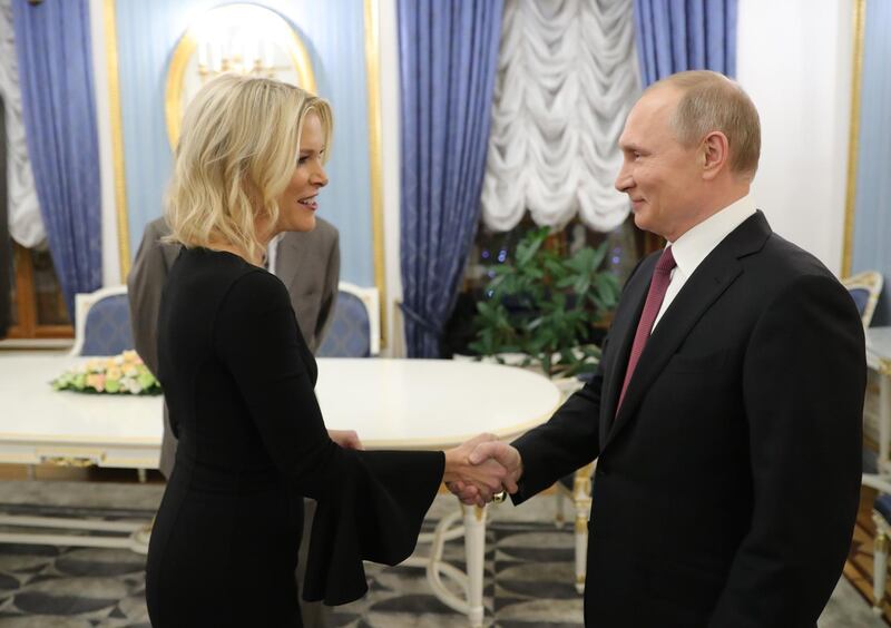 Russia's President Vladimir Putin (R) shakes hands with US NBC news network anchor Megyn Kelly prior to an interview at the Kremlin on March 1, 2018 in Moscow. / AFP PHOTO / SPUTNIK / Michael Klimentyev
