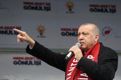 Turkey's President Recep Tayyip Erdogan gestures as he delivers a speech at a rally of his ruling Justice and Development Party's (AKP) in Gaziantep, southeastern Turkey, Friday, March 15, 2019, ahead of local elections scheduled for March 31, 2019. Erdogan says at least three Turkish citizens were injured in the attack that targeted Muslim worshippers in New Zealand and that he has spoken to one of them. Turkish media reports said the man had left a 74-page manifesto that among other things, threatened to make Istanbul _ which was called Constantinople before the Ottoman conquest _ "Christian-owned once more." (Presidential Press Service via AP, Pool)