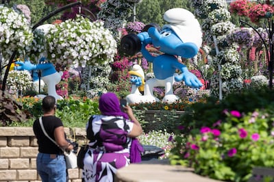 Dubai Miracle Garden has opened again to visitors for the winter season, with new attractions such as the Smurfs Village and new flower arrangements. Antonie Robertson / The National


