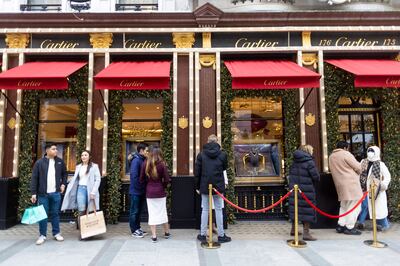 Shoppers queue to enter the Cartier luxury boutique on New Bond Street in London, UK. Bloomberg