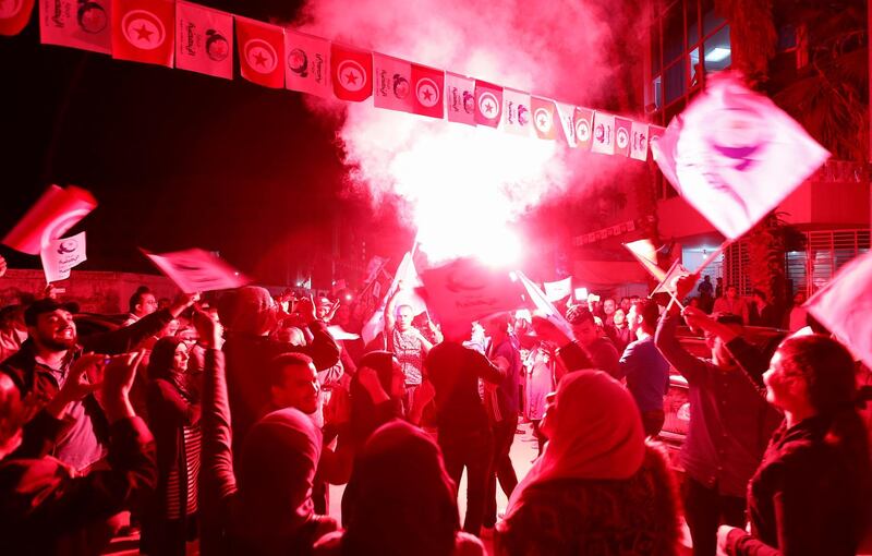 Supporters of the Islamist Ennahda party celebrate outside the party's headquarters after claiming victory in a local poll in Tunis, Tunisia, May 6, 2018. REUTERS/Zoubeir Souissi