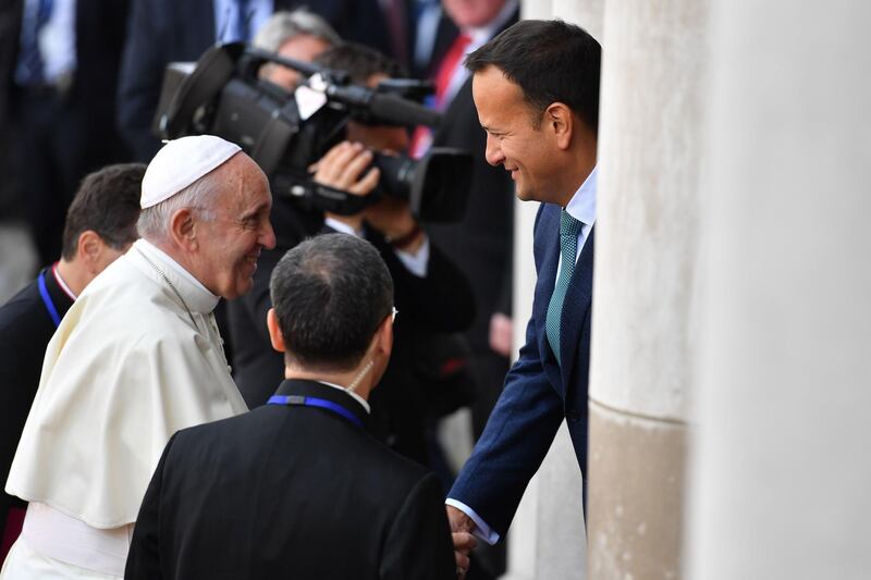 Pope Francis is greeted by Mr Varadkar on his arrival at Dublin Castle. AFP