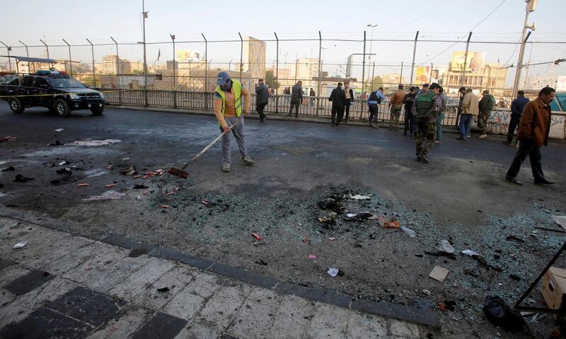 Iraqi security forces inspect the site of a bomb attack in Baghdad, Iraq January 15, 2018. REUTERS/Khalid al Mousily     TPX IMAGES OF THE DAY