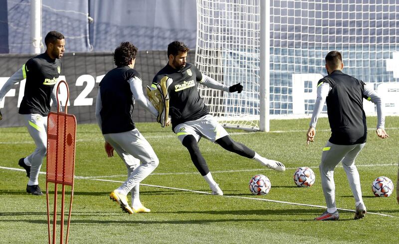 Atletico's Diego Costa, centre, training with teammates. EPA