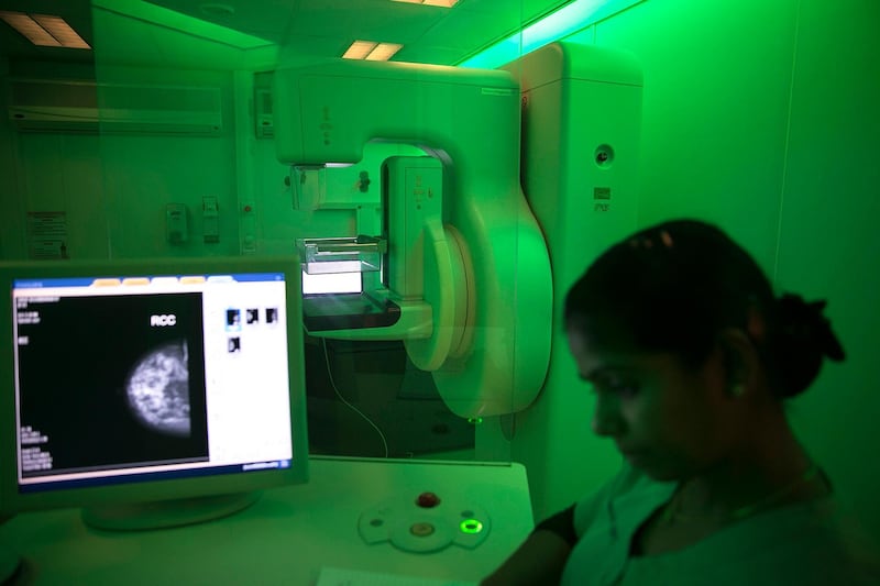 ABU DHABI, UNITED ARAB EMIRATES, Oct. 12, 2014:  
At right, Honey S Babu, a radiology technician, checks the computer inside a mobile mammogram clinic, which provided for free breast-cancer screening for scheduled and walk-in clients, as the van parked outside of the Delma Mall in Musaffah, on Sunday, Oct. 12, 2014. The van, provided by the LLH Hospital in Musaffah, is being sent to various residential areas and malls for breast cancer awareness month. According to the van staff, the mobile mammogram provided a free screening for 152 women in just 14 days. (Silvia Razgova / The National)

Usage: undated
Section: NA
Reporter:  stock


