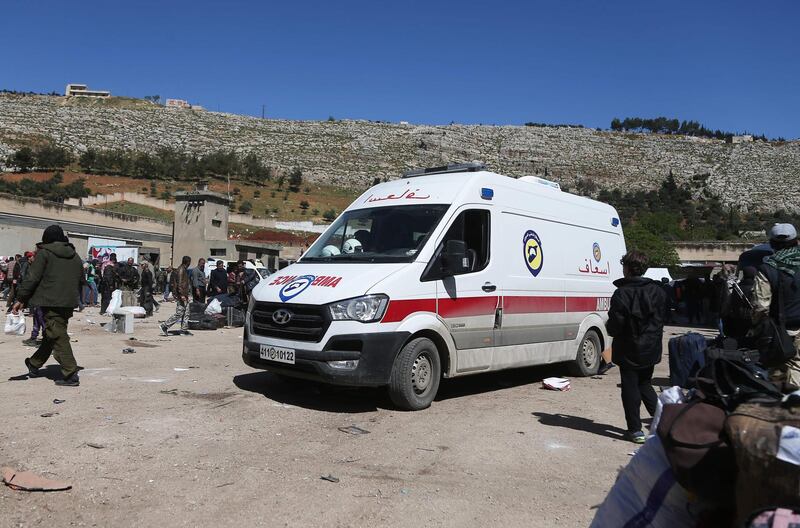 Syrian civilians and rebel fighters evacuated from Eastern Ghouta arrive in the village of Qalaat al-Madiq, some 45 kilometres northwest of the central city of Hama, on March 26, 2018, as evacuations from Eastern Ghouta continued following a deal that was announced earlier in the week. Abdulmonam Eassa / AFP