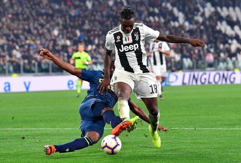 Juventus' Moise Kean, right, and Udinese's Ben Wilmot in action. ANSA via AP