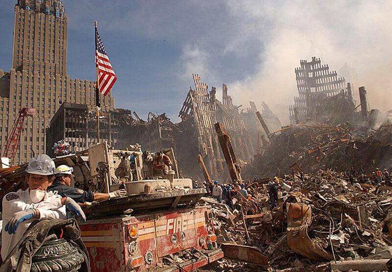 In this photo obtained 18 September 2001 from the Federal Emergency Management Agency (FEMA), firefighters and Urban Search and Rescue workers battle smoldering fires as they search for survivors at the ruins of the World Trade Center in New York 13 September 2001.  Rescue and recovery work continues at the site of the devastation in downtown Manhattan but hopes of finding anyone alive in the ruins of the World Trade Center have almost faded, New York Mayor Rudolph Giuliani said 18 September, one week after the terrorist attack that toppled the twin towers.  
 AFP PHOTO / FEMA / ANDREA BOOHER (Photo by ANDREA BOOHER / FEMA / AFP)